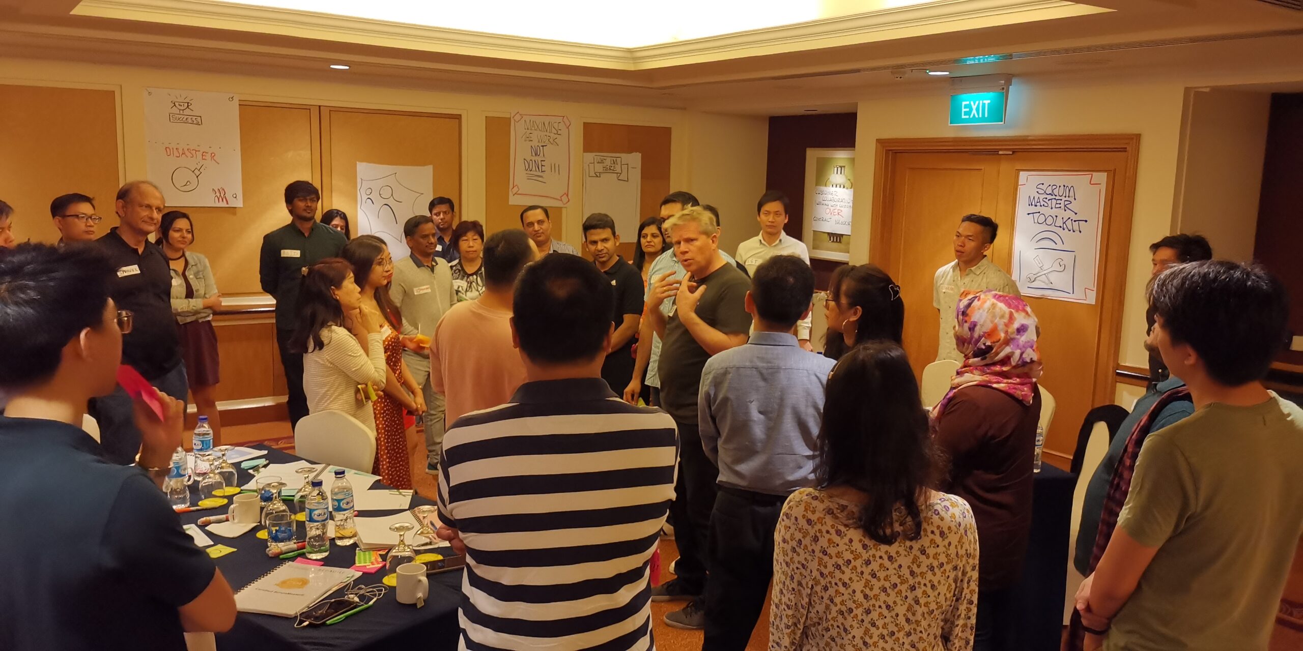 Trainer giving speech in front of a crowd