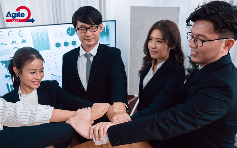 agile team putting hands together